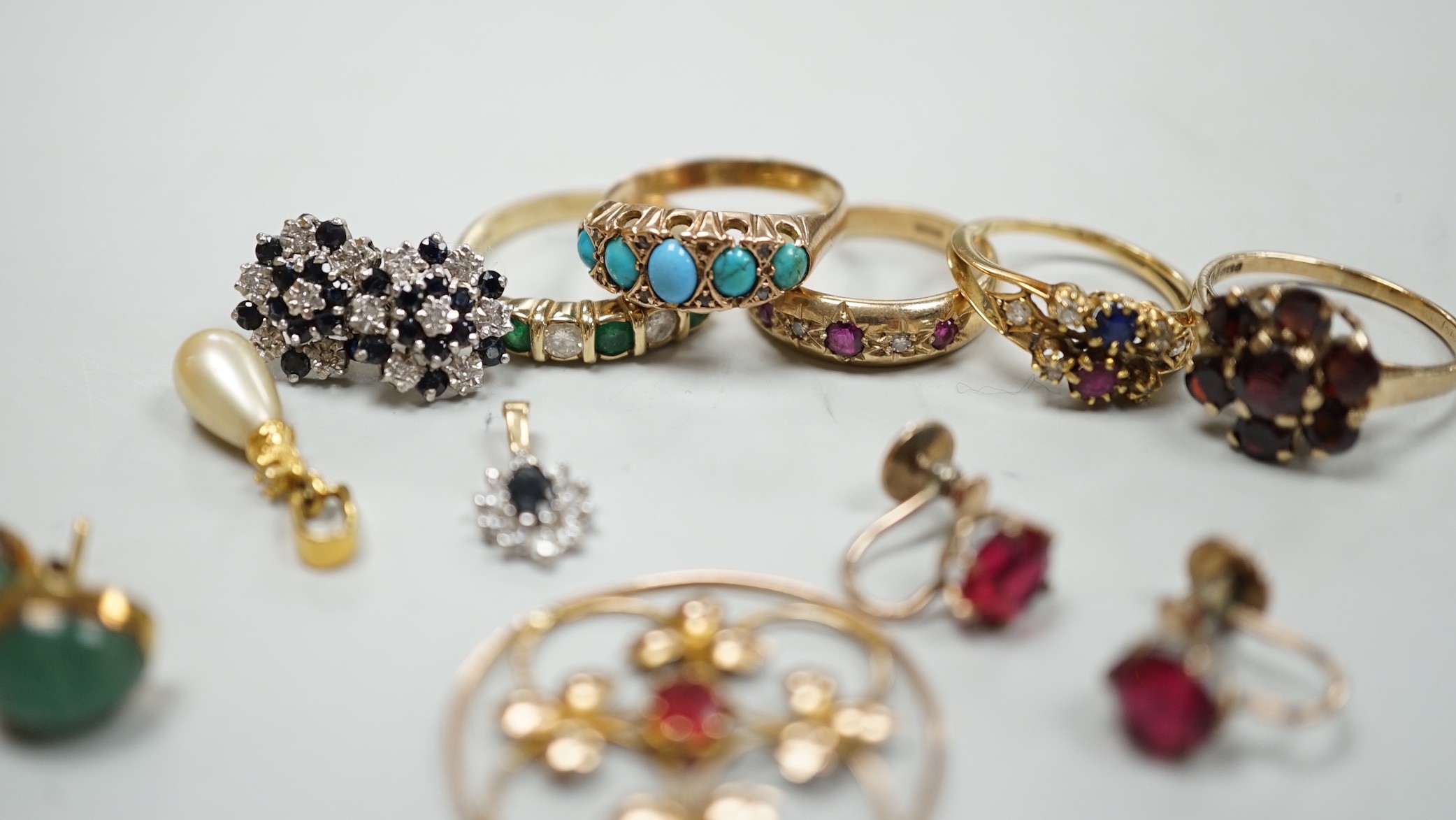 Five assorted 9k and gem set rings including ruby and diamond gypsy set and other jewellery.